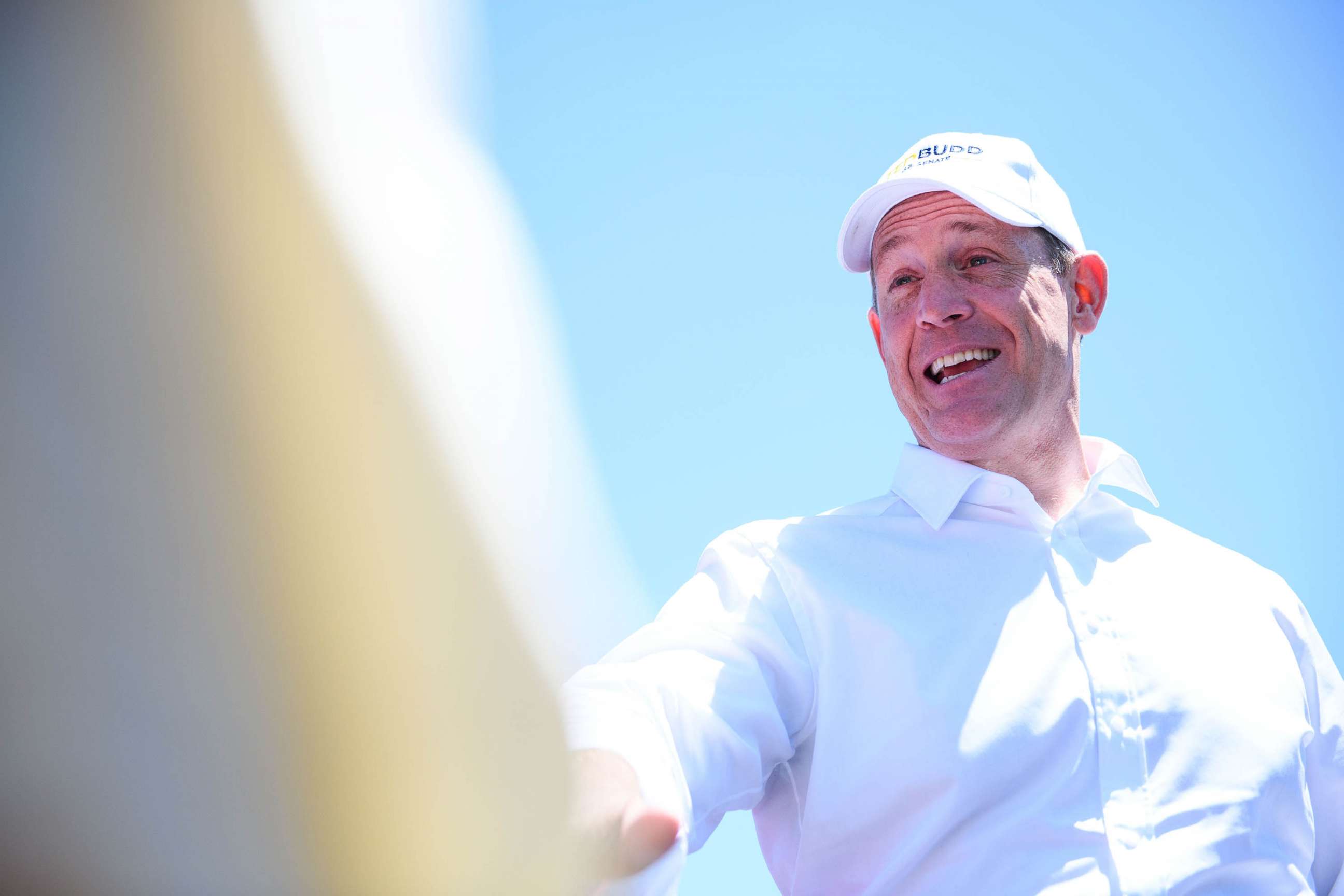 PHOTO: Rep. Tedd Budd greets voters and local campaigners on Primary day in Belews Creek, N.C.,  May 17, 2022.