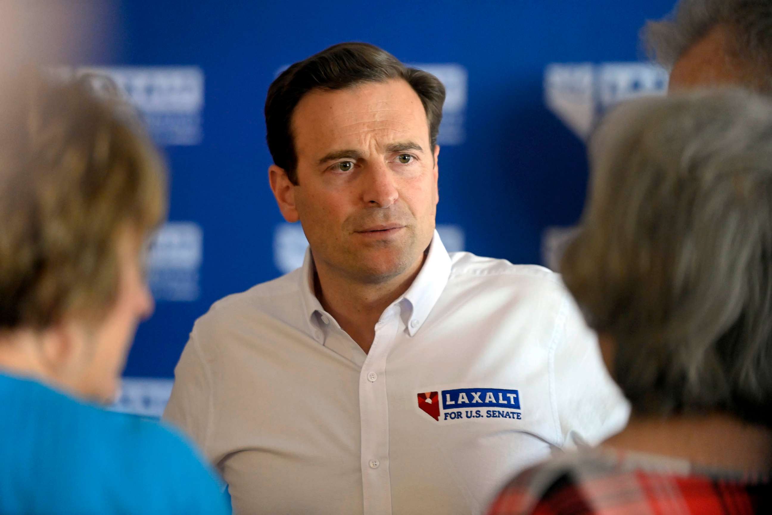 PHOTO: Nevada Senate candidate Adam Laxalt speaks with people during a campaign event in Logandale, Nev., June 11, 2022.
