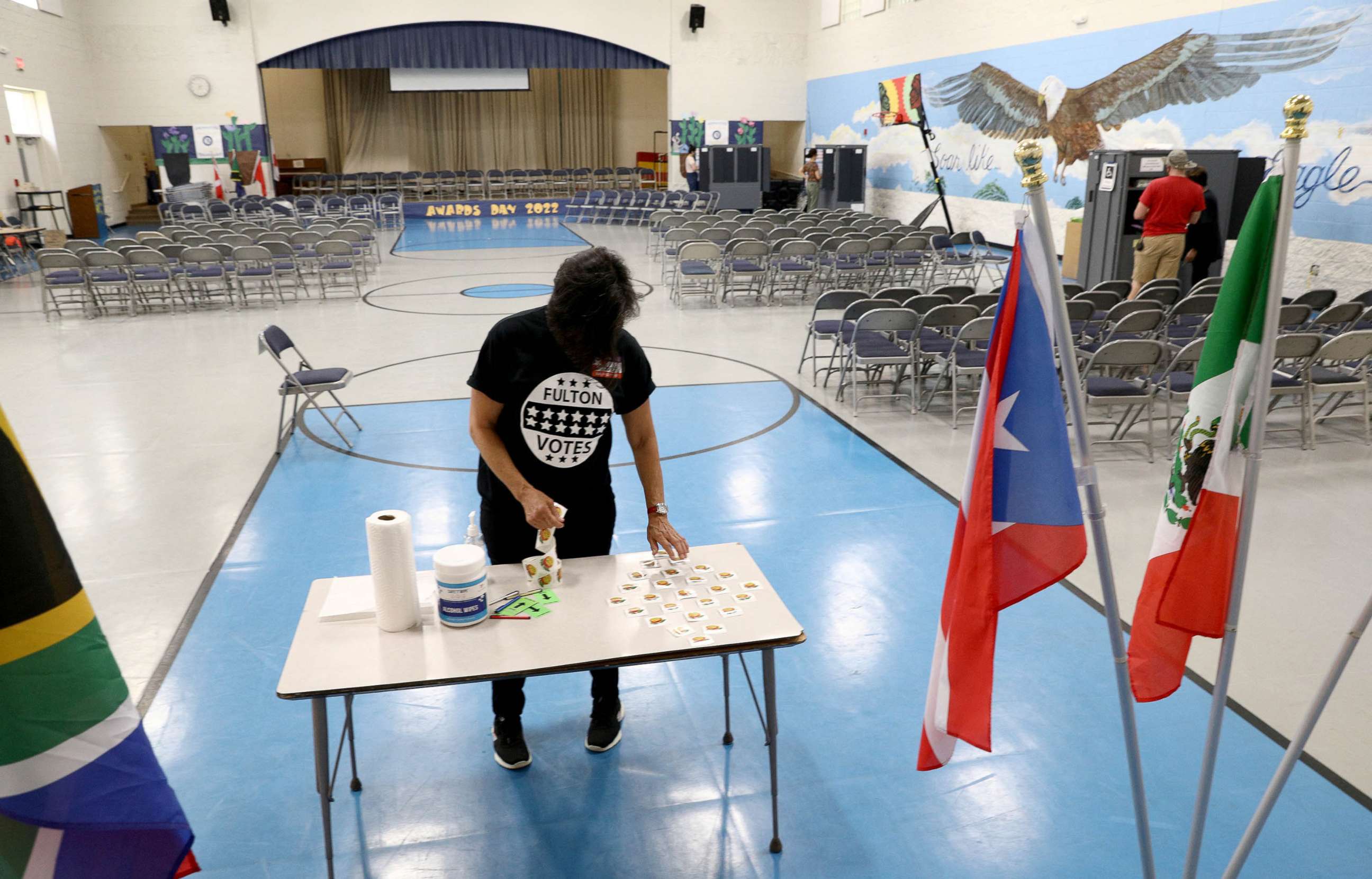 PHOTO: A poll worker lays out voter stickers at a polling station during the primary election in Atlanta, Ga., May 24, 2022.
