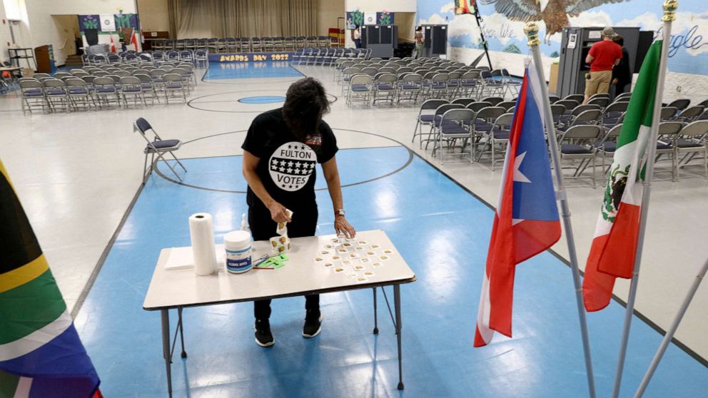  A poll worker lays out voter stickers at a polling station during the primary election in Atlanta, Ga., May 24, 2022.
