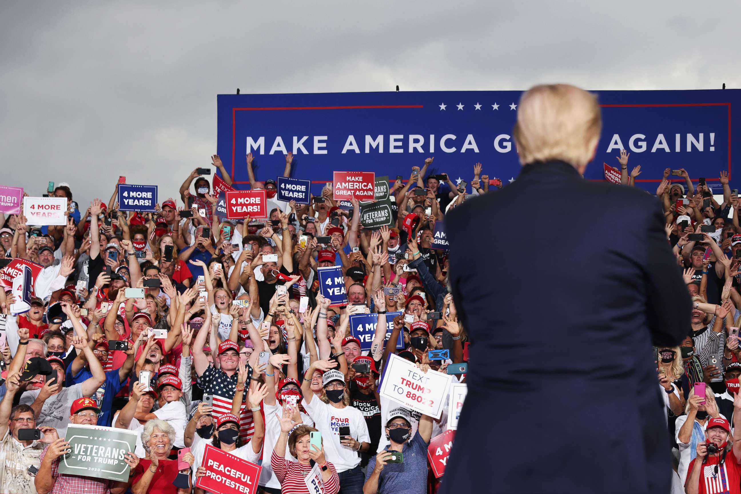 PHOTO: Supporters cheer as U.S. President Donald Trump speaks during a campaign event at Smith Reynolds Regional Airport in Winston-Salem, N.C., Sept. 8, 2020.