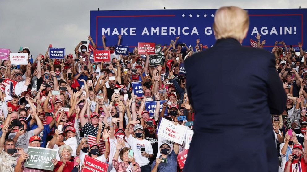 PHOTO: Supporters cheer as U.S. President Donald Trump speaks during a campaign event at Smith Reynolds Regional Airport in Winston-Salem, N.C., Sept. 8, 2020.
