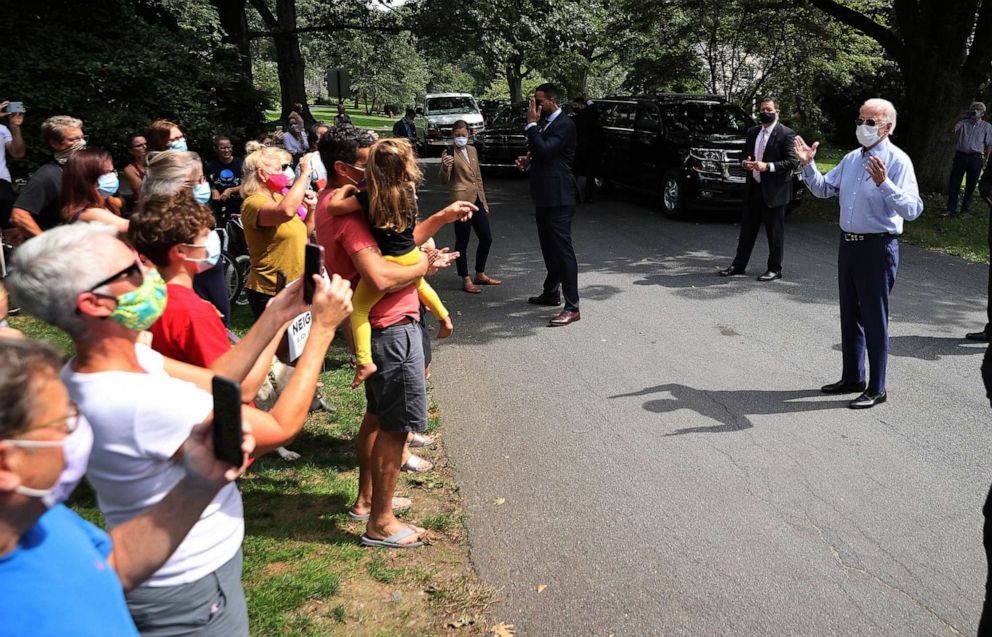 PHOTO: Democratic presidential nominee  Joe Biden talks to neighbors who gathered outside his meeting with veterans union leaders in Lancaster, Pa., Sept. 7, 2020.
