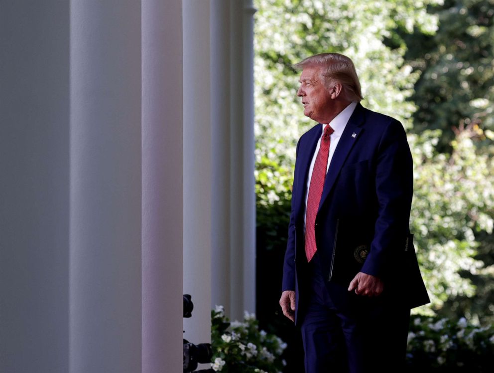 PHOTO: President Donald Trump walks into the Rose Garden as he holds a press conference at the White House, July 14, 2020.