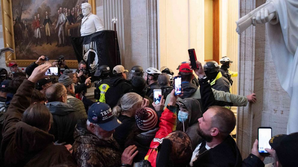 PHOTO: Supporters of President Donald Trump protest in the US Capitol's Rotunda, Jan. 6, 2021, in Washington, DC.