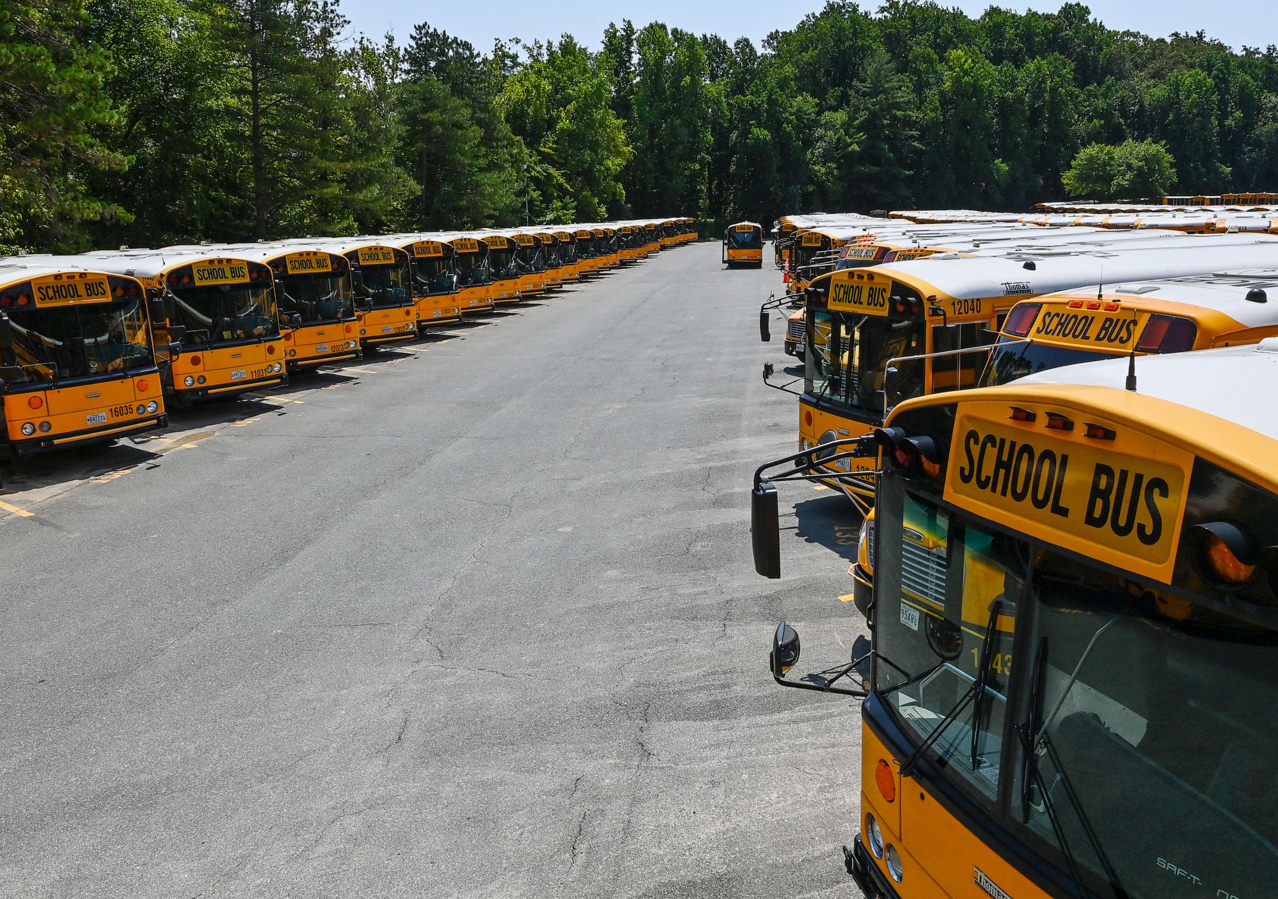 PHOTO: Montgomery County Public Schools aims to transition its more than 1,400 school buses, some seen here on Feb. 25, 2019, to electric-powered vehicles within a decade.