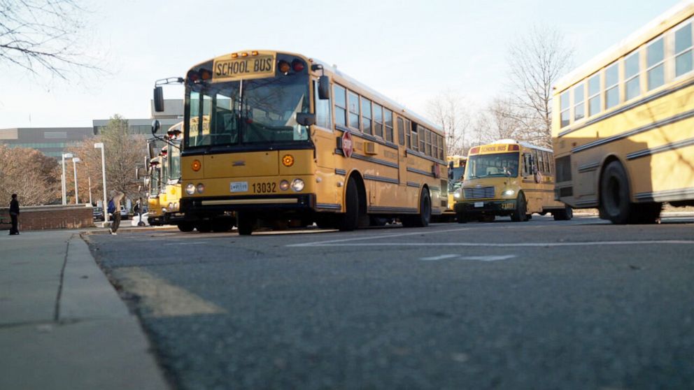 PHOTO: School buses leave a high school in Bethesda, Maryland.