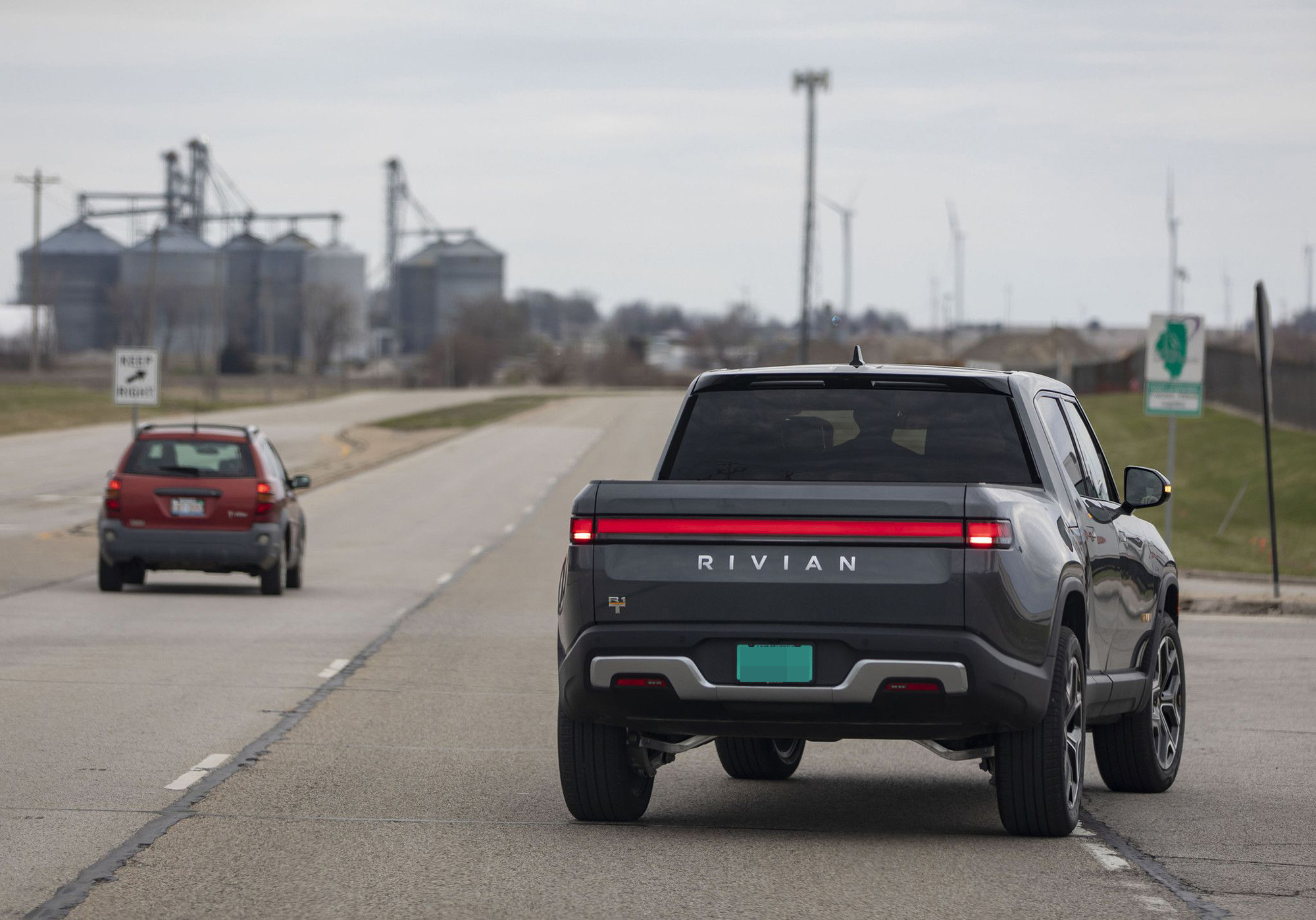 PHOTO: In this April 11, 2022, file photo, an R1T truck is shown on the road outside the Rivian electric vehicle plant in Normal, Il.