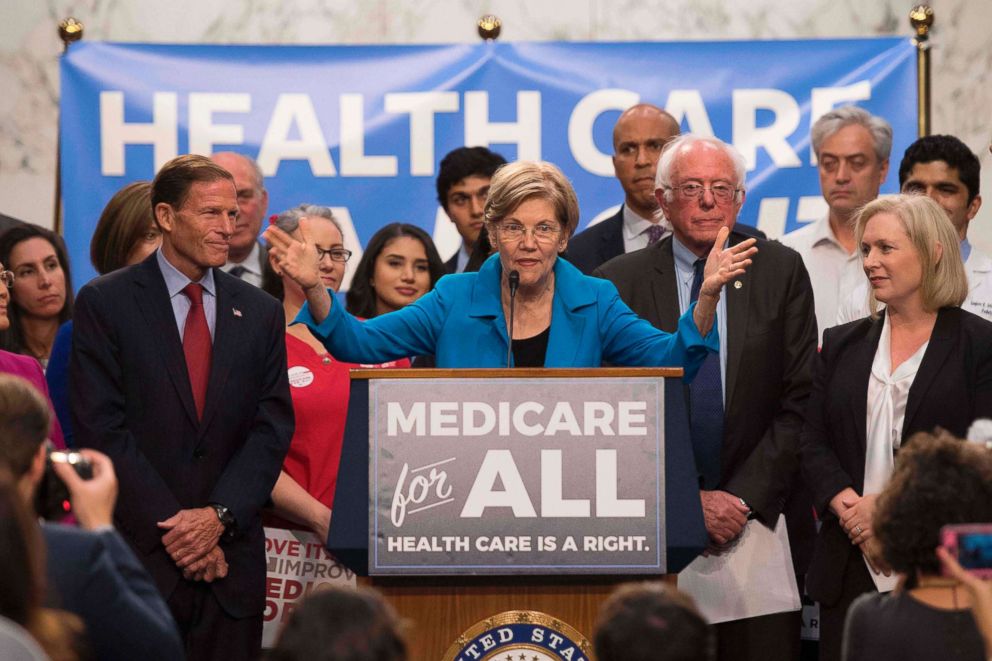 PHOTO: Sen. Elizabeth Warren, center, speaks alongside other members of congress as they discuss Medicare for All legislation on Capitol Hill in Washington, DC.