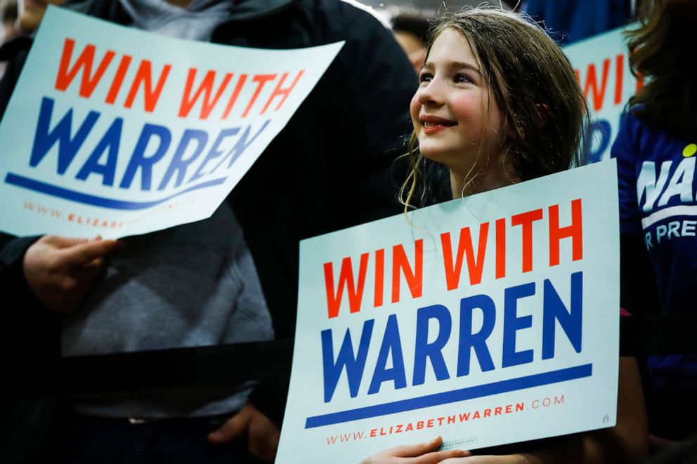 PHOTO: Attendees listen to Democratic presidential candidate Sen. Elizabeth Warren, D-Mass., speak during a campaign event at Rundlett Middle School, Feb. 9, 2020, in Concord, N.H.