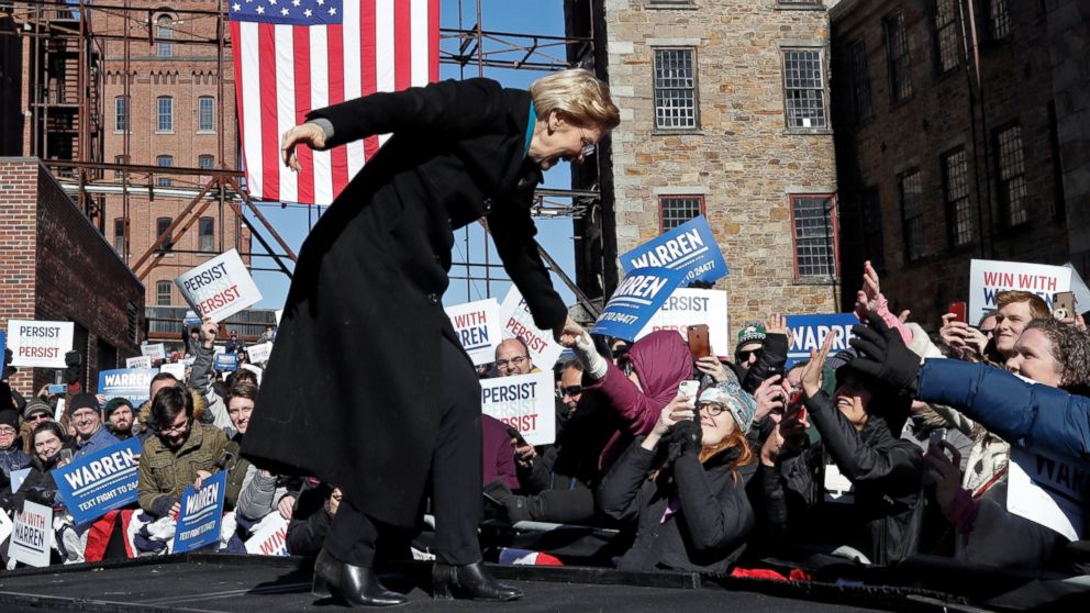 Sen. Elizabeth Warren, D-Mass., shakes hands with supporters as she takes the stage during an event to formally launch her presidential campaign, Saturday, Feb. 9, 2019, in Lawrence, Mass.