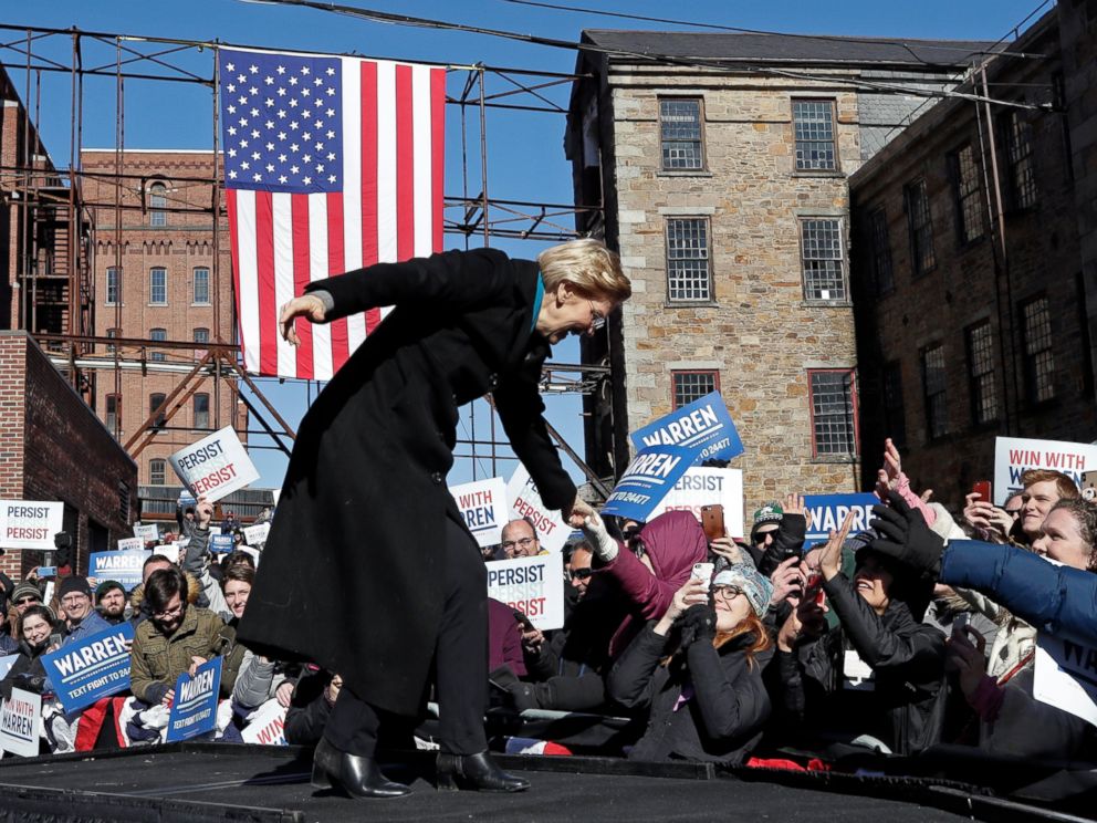 PHOTO: Sen. Elizabeth Warren, D-Mass., shakes hands with supporters as she takes the stage during an event to formally launch her presidential campaign, Saturday, Feb. 9, 2019, in Lawrence, Mass.