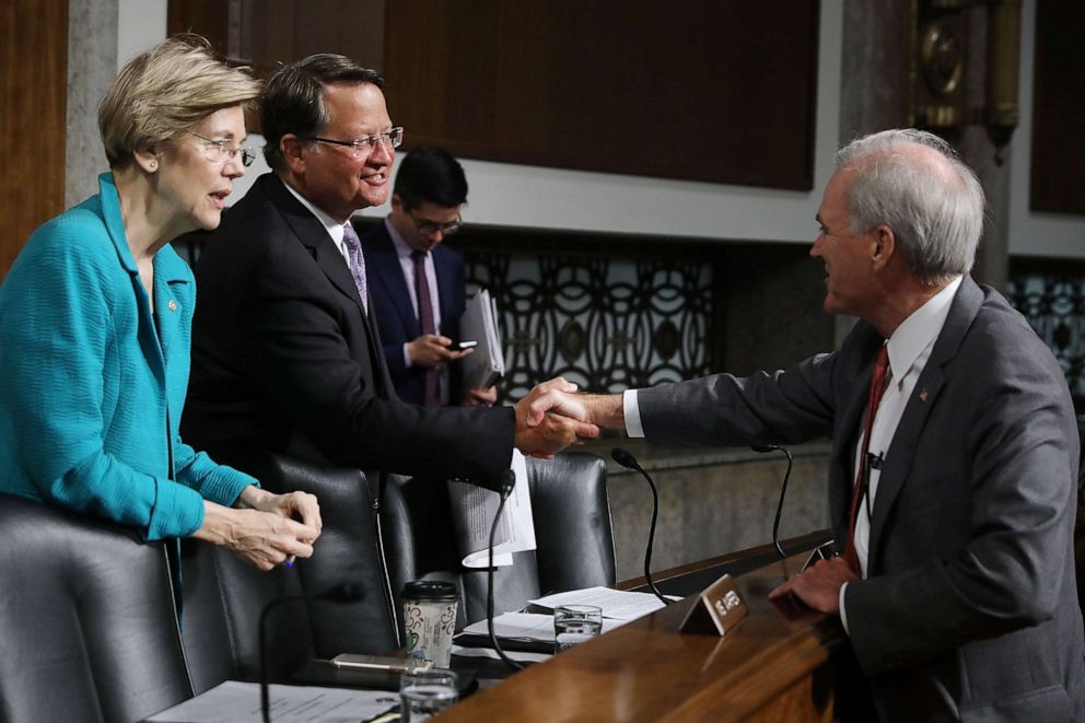 PHOTO: In this July 11, 2017, file photo, Senate Armed Services Committee members Sen. Elizabeth Warren and Sen. Gary Peters greet Richard Spencer before his confirmation hearing in the Dirksen Senate Office Building on Capitol Hill in Washington, DC.