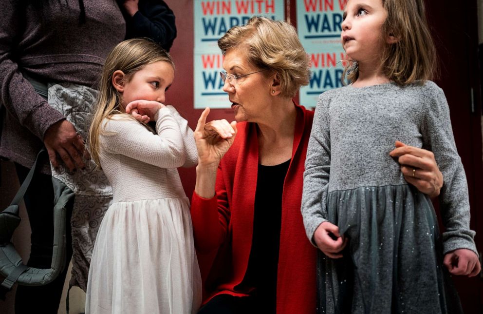 PHOTO: Democratic Presidential Candidate Sen. Elizabeth Warren makes pinky promises with little girls and before a get-out-the-vote event at Rundlett Middle School in Concord, N.H., on Feb. 9, 2020.