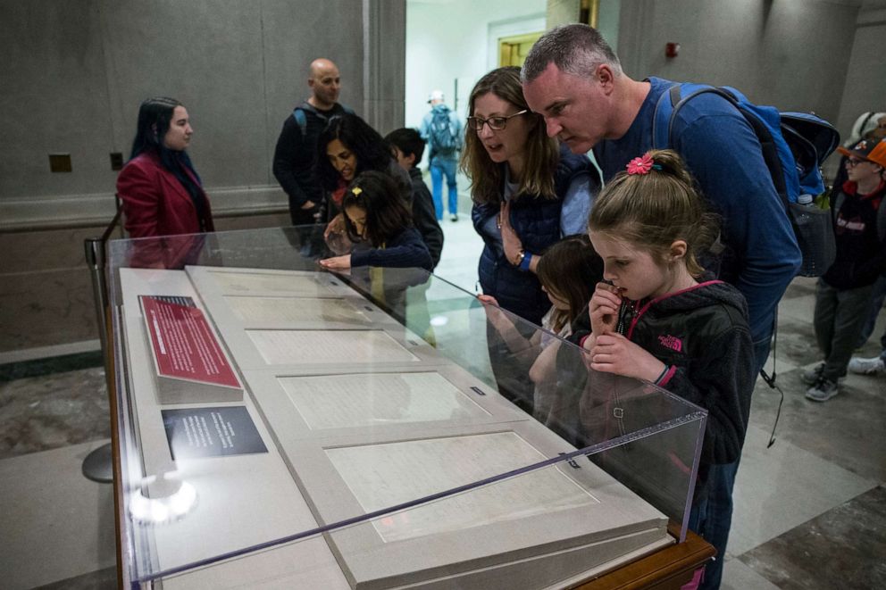 PHOTO: People look at the Emancipation Proclamation at the National Archives on April 16, 2019, in Washington, D.C.