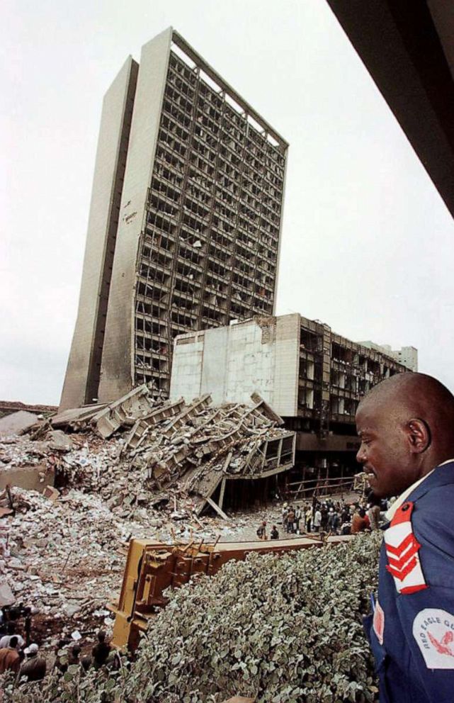 PHOTO: NAIROBI, KENYA: In this Aug. 7, 1998, file photo, a Kenyan guard looks at the site of a bomb blast at the US embassy in Nairobi that killed at least 111 people and injured more than 4,000. 