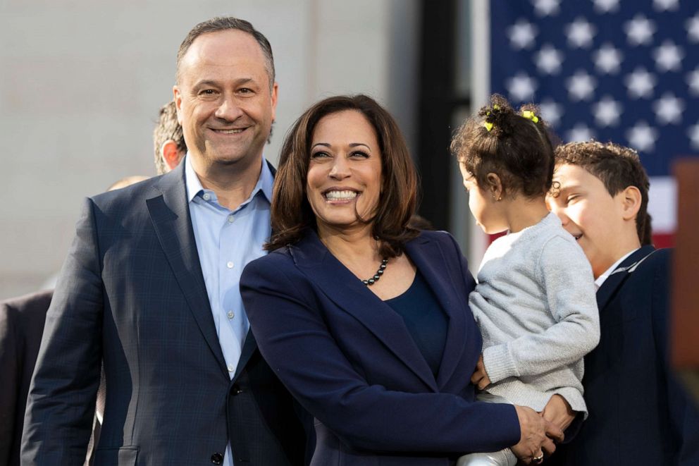 PHOTO: Senator Kamala Harris, her husband Doug Emhoff and her niece Amara Ajagu wave to crowd after her first presidential campaign rally at Frank Ogawa Square in Oakland, Calif., Jan. 27, 2019.