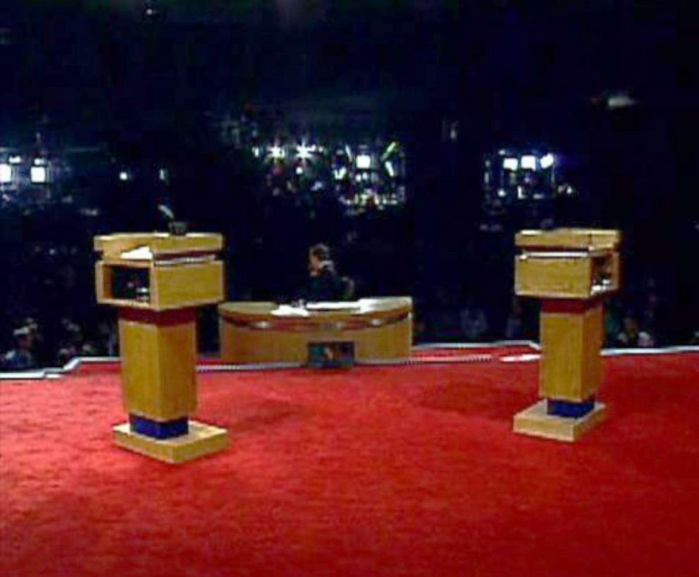 PHOTO: Empty podiums are set up prior to a debate in 2004.