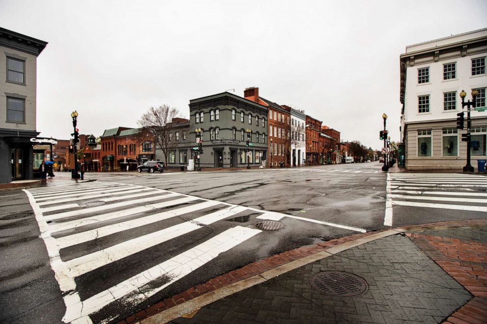 PHOTO: The streets in the shopping district of Georgetown are nearly empty, March 25, 2020, in Washington, DC.