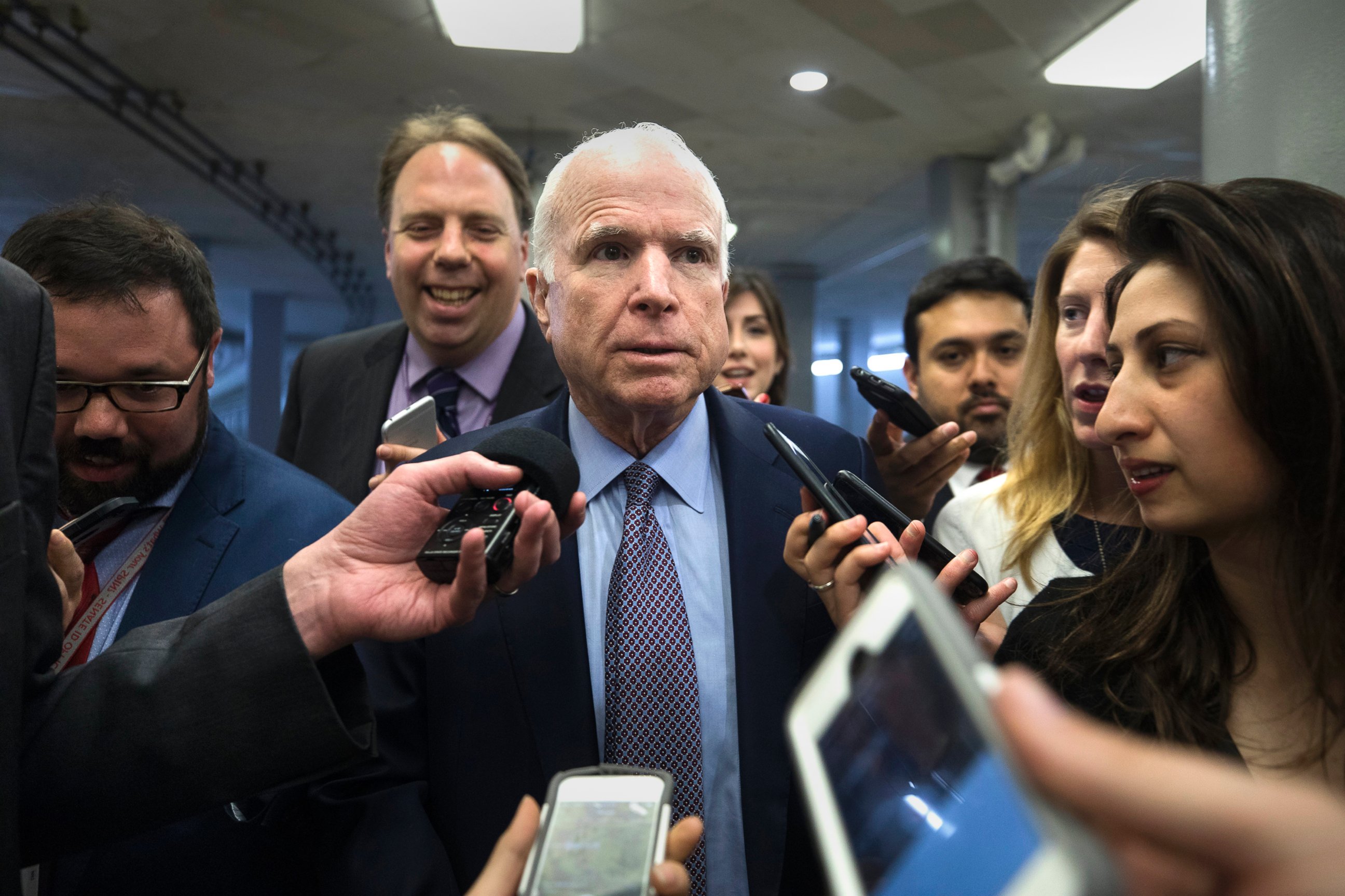 PHOTO: Sen. John McCain speaks to the media in a hallway the U.S. Capitol in Washington, D.C., May 16, 2017. 