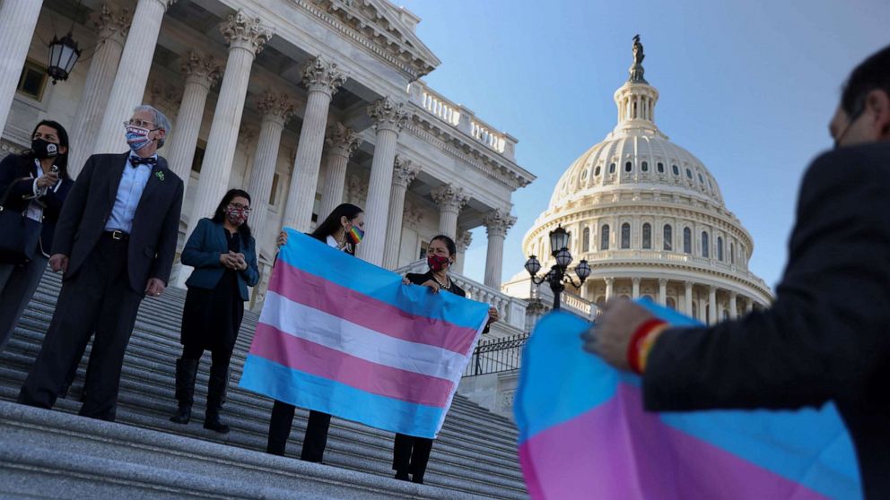 PHOTO: Rep. Deb Haaland holds a Transgender Pride flag beside democratic colleagues on Capitol Hill, Feb. 25, 2021. 