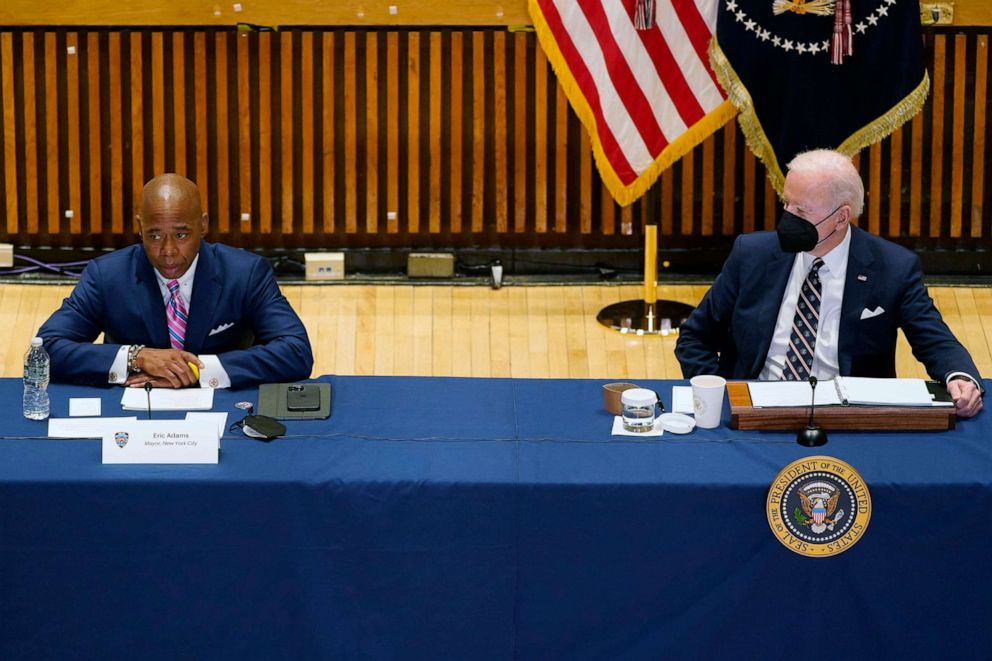 PHOTO: President Joe Biden listens to New York City Mayor Eric Adams speak at an event to discuss gun violence strategies, at police headquarters, on Feb. 3, 2022, in New York.