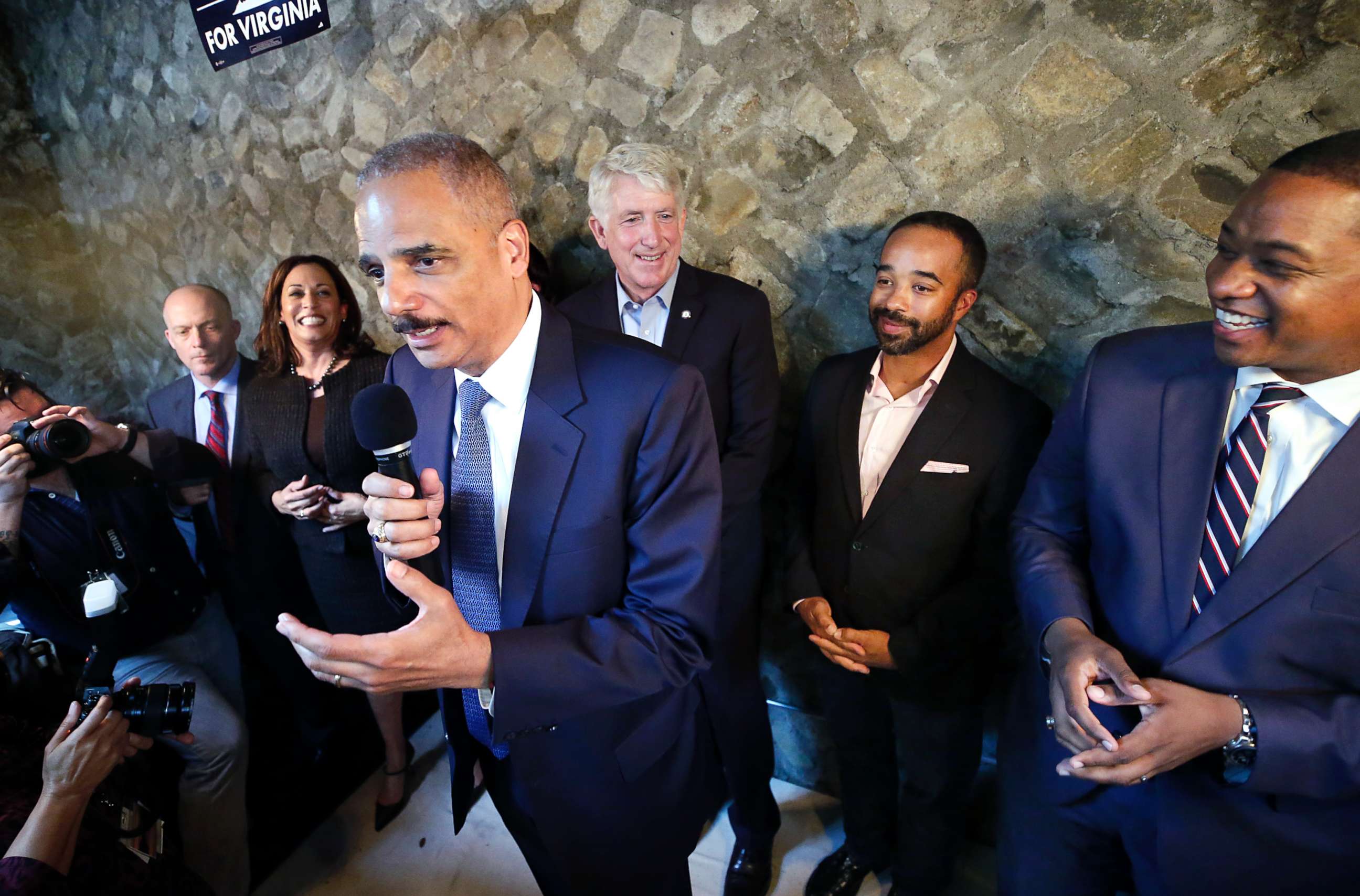 PHOTO: Former Attorney General Eric Holder, center, speaks during a get-out-the-vote event at Blue Bee Cider in Richmond, Va., Oct. 29, 2017.