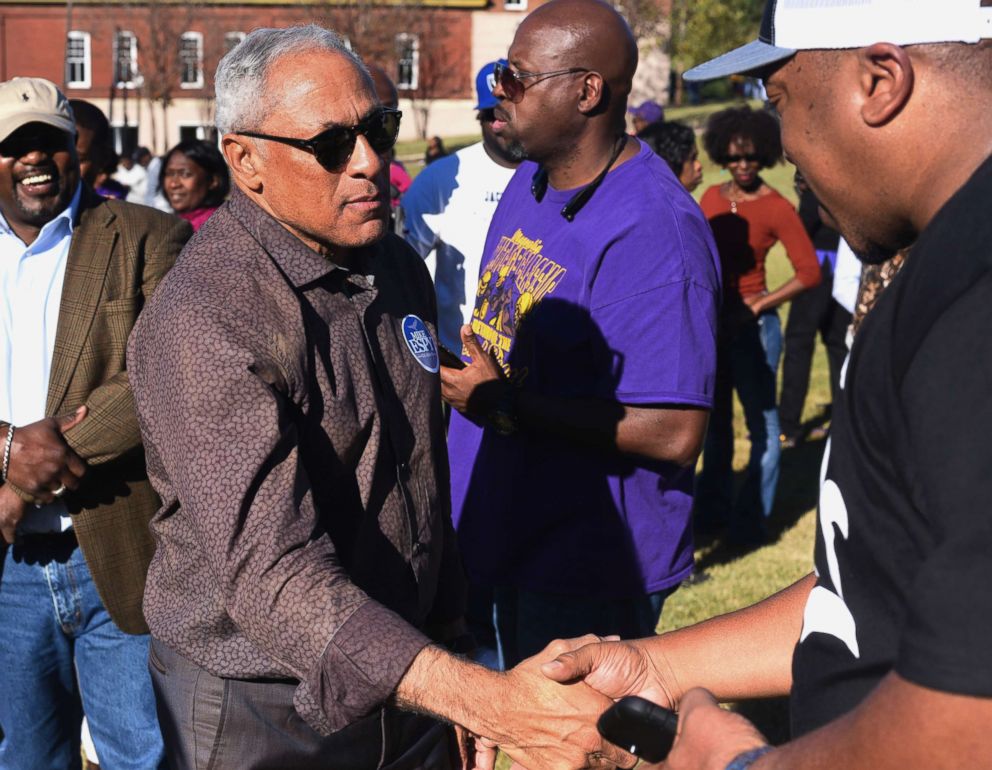 PHOTO: Mike Espy, who is seeking to unseat appointed Sen. Cindy Hyde-Smith, R-Miss., shakes hands with a supporter during a rally in Vicksburg, Miss., Nov. 16, 2018. 