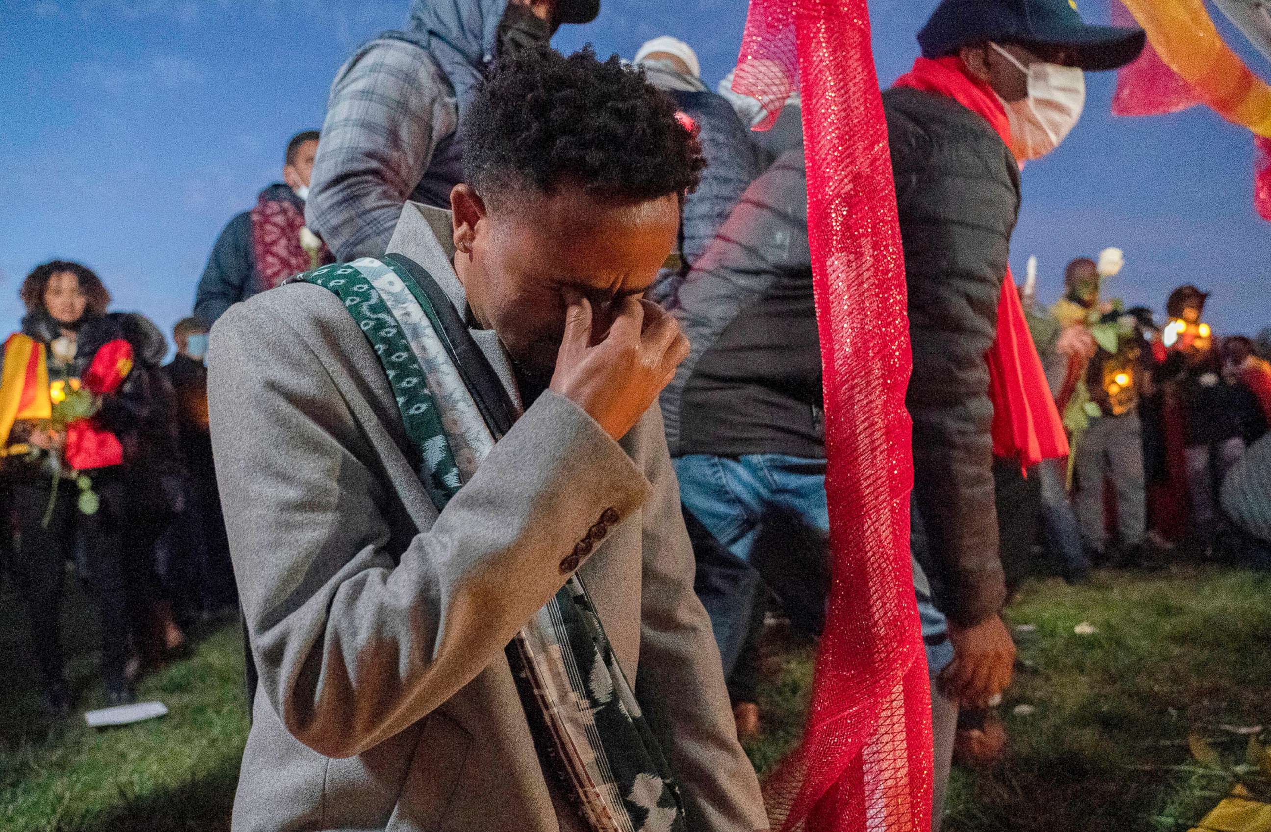 PHOTO: Angesom cries after offering flowers during an event in Washington to commemorate Gebrehiwot Yemane and Haben Sahle Newfie, his two-nephews who were among the people killed in the Ethiopia attacks in Tigray, Ethiopia, Nov. 4, 2021.
