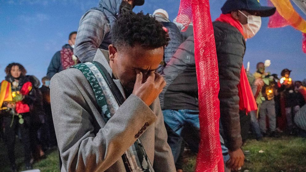 PHOTO: Angesom cries after offering flowers during an event in Washington to commemorate Gebrehiwot Yemane and Haben Sahle Newfie, his two-nephews who were among the people killed in the Ethiopia attacks in Tigray, Ethiopia, Nov. 4, 2021.