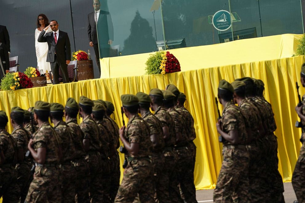 PHOTO: Prime Minister Abiy Ahmed salutes members of the Ethiopian Military as they march during an inaugural celebration after Amhed was sworn in for a second five year term as Prime Minister of Ethiopia on Oct. 04, 2021, in Addis Ababa, Ethiopia.