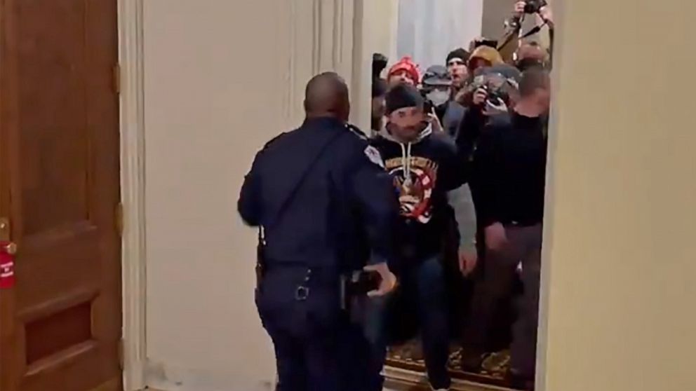 PHOTO: Capitol Police Officer Eugene Goodman confronts a mob of President Trump's supporters inside the U.S. Capitol in Washington on Jan. 6, 2021.