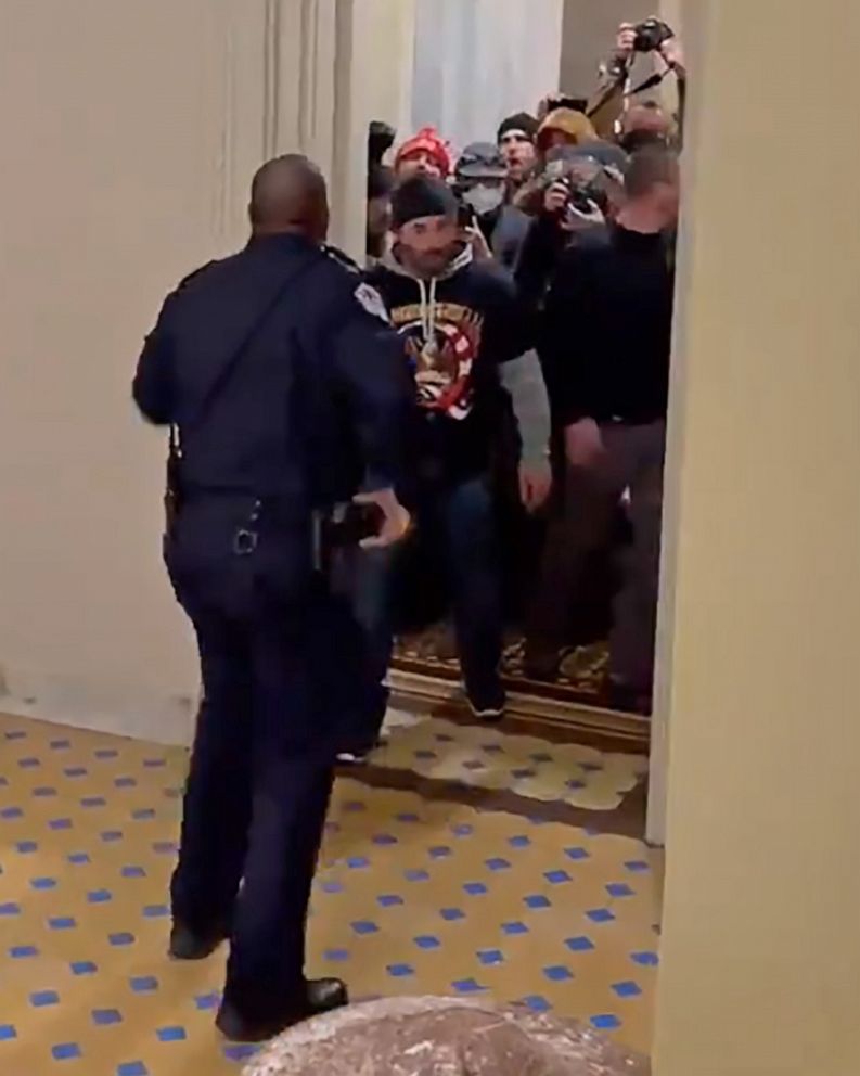 PHOTO: Capitol Police Officer Eugene Goodman confronts a mob of President Trump's supporters inside the U.S. Capitol in Washington on Jan. 6, 2021.