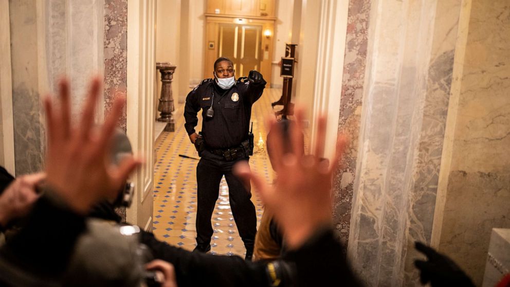 PHOTO: In this Jan. 6, 2021, file photo, US Capitol Police (USCP) Officer Eugene Goodman confronts protesters as they storm the Capitol in Washington, D.C.
