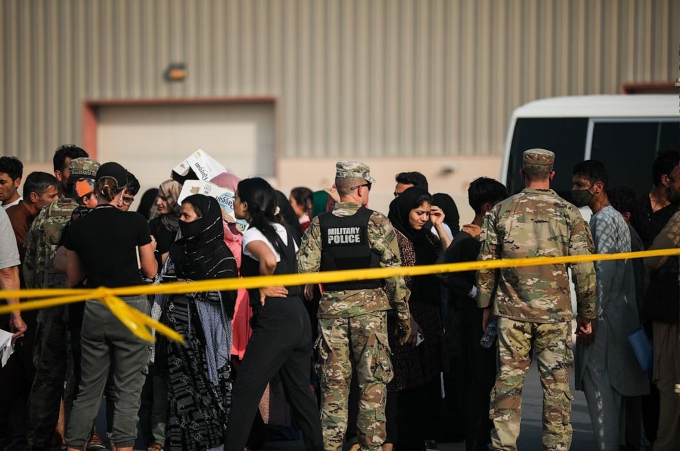 PHOTO: Evacuees from Afghanistan gather as they await safe passage to Germany after completing out-processing at Camp As Sayliyah, Qatar, Aug. 23, 2021.