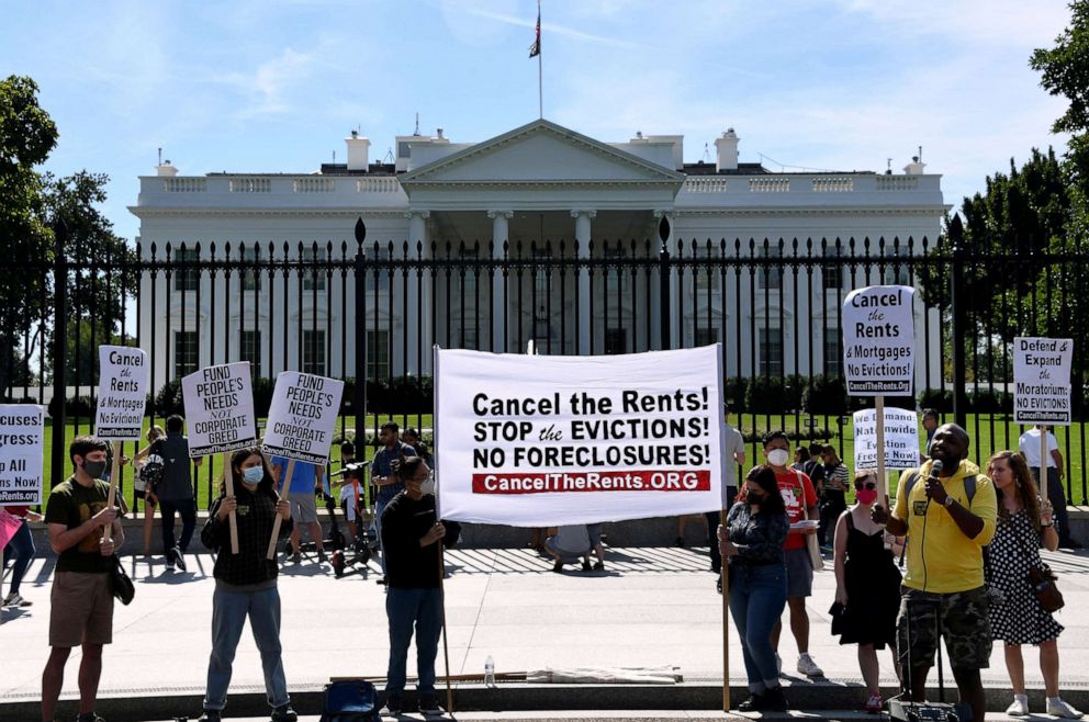 PHOTO: Demonstrators hold placards in front of the White House, Sept. 25, 2021, to call for the cancellation of rents, mortgages, and to prevent millions of evictions in the middle of a resurgence of the COVID-19 pandemic.