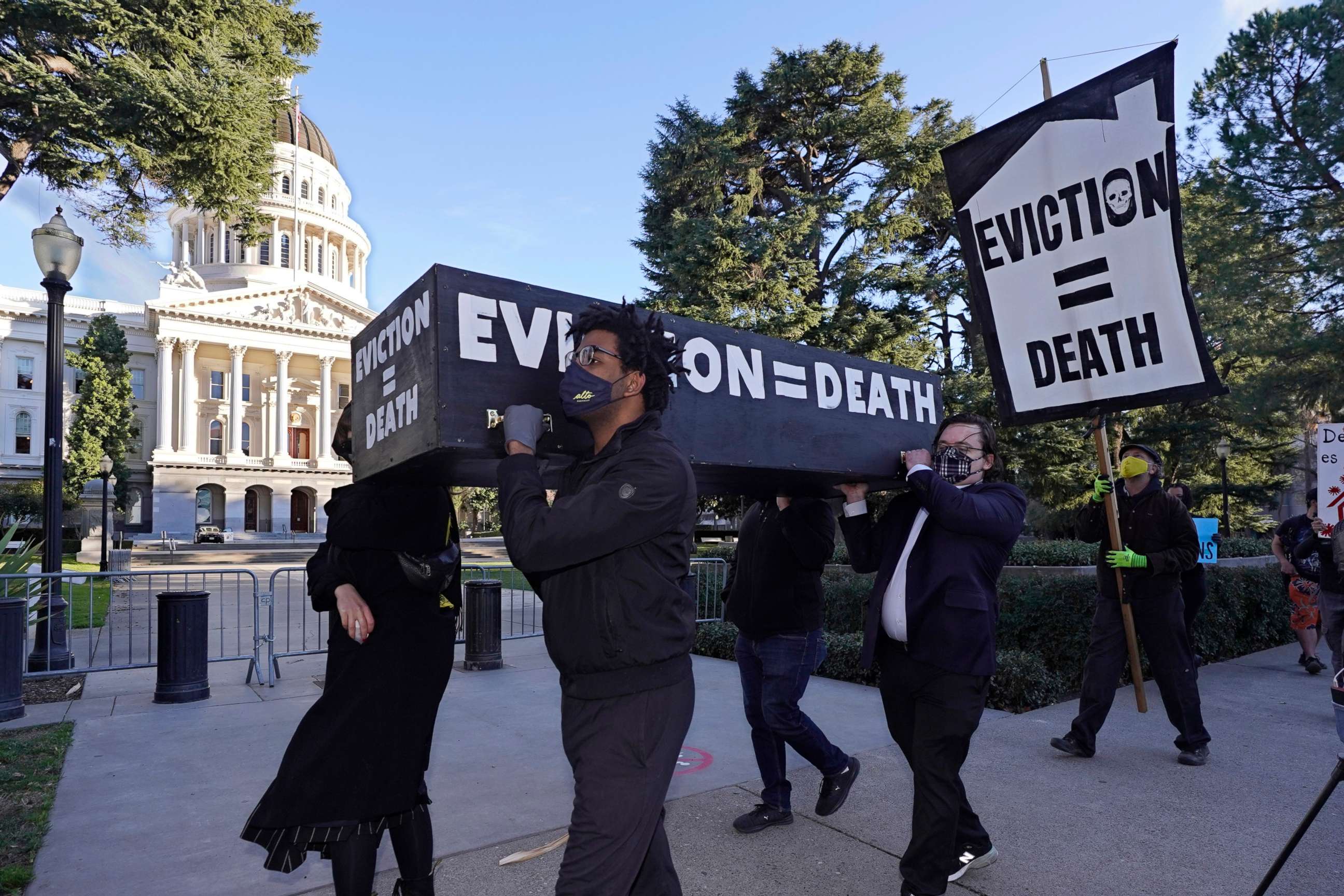 PHOTO: In this Jan. 25, 2021, file photo, demonstrators call passage of rent forgiveness and stronger eviction protections legislation and carry a mock casket past the Capitol in Sacramento, Calif.