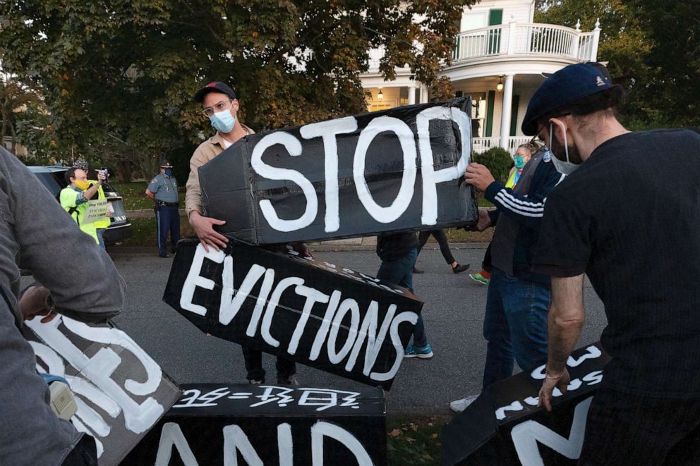 Housing activists erect a sign in Swampscott, Massachusetts, on Oct. 14, 2020. The Biden administration on July 29, 2021 called on Congress to extend a federal freeze on evictions set to expire on Saturday, arguing its hands are tied by the Supreme Court.