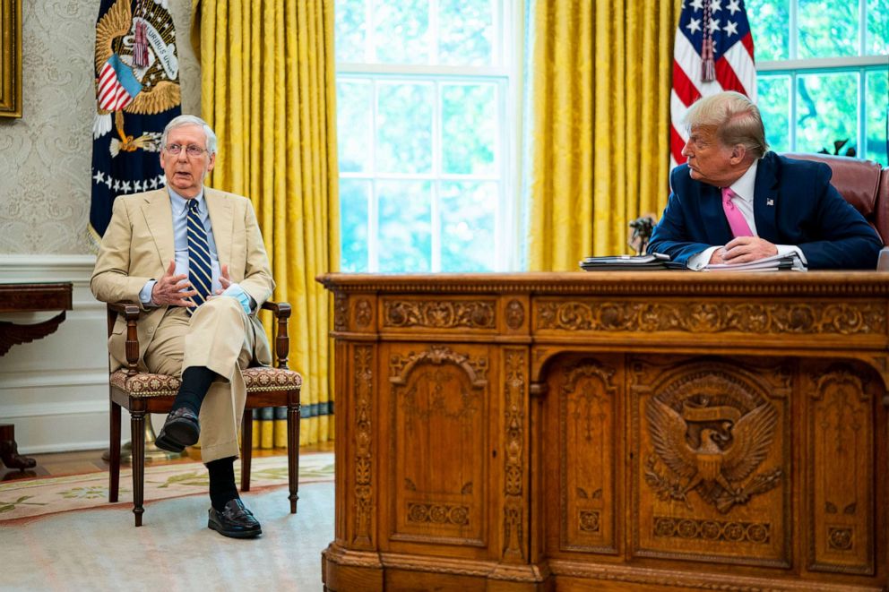 PHOTO: Senate Majority Leader Mitch McConnell joins President Donald Trump while speaking to reporters while hosting Republican congressional leaders and members of Trump's cabinet in the Oval Office of the White House, July 20, 2020.