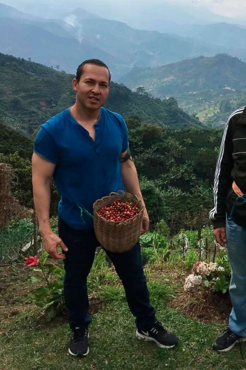 PHOTO: Eyvin Hernandez picks coffee beans while on vacation in Colombia in 2019.