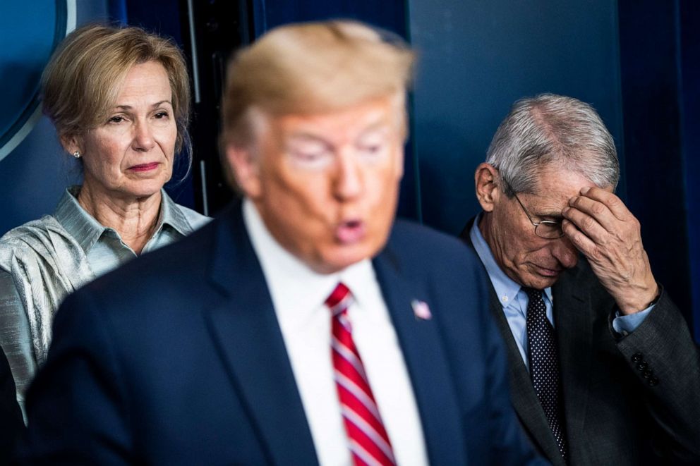 PHOTO: Dr. Deborah Birx and Dr. Anthony Fauci listen as President Donald J. Trump speaks with the coronavirus task force during a briefing on March 20, 2020 in Washington.