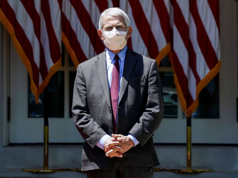 PHOTO: National Institute of Allergy and Infectious Diseases Director Dr. Anthony Fauci listens as President Donald Trump speaks about administration efforts to develop a coronavirus vaccine in the Rose Garden of the White House, May 15, 2020.