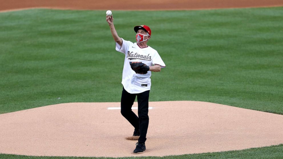 PHOTO: Dr. Anthony Fauci, director of the National Institute of Allergy and Infectious Diseases throws out the ceremonial first pitch.