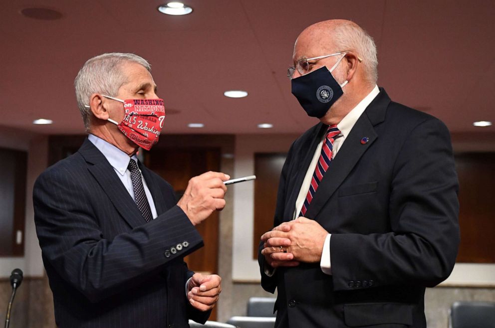 PHOTO: Dr. Anthony Fauci and Dr. Robert Redfield talk prior to the Senate Health, Education, Labor and Pensions (HELP) Committee hearing on Capitol Hill in Washington DC on June 30, 2020.