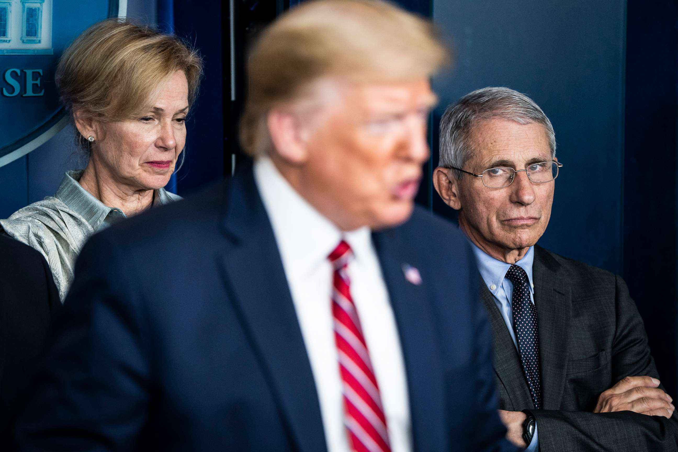 PHOTO: Dr. Anthony Fauci, right, listens as President Donald J. Trump speaks during a news conference at the White House, March 20, 2020 in Washington.