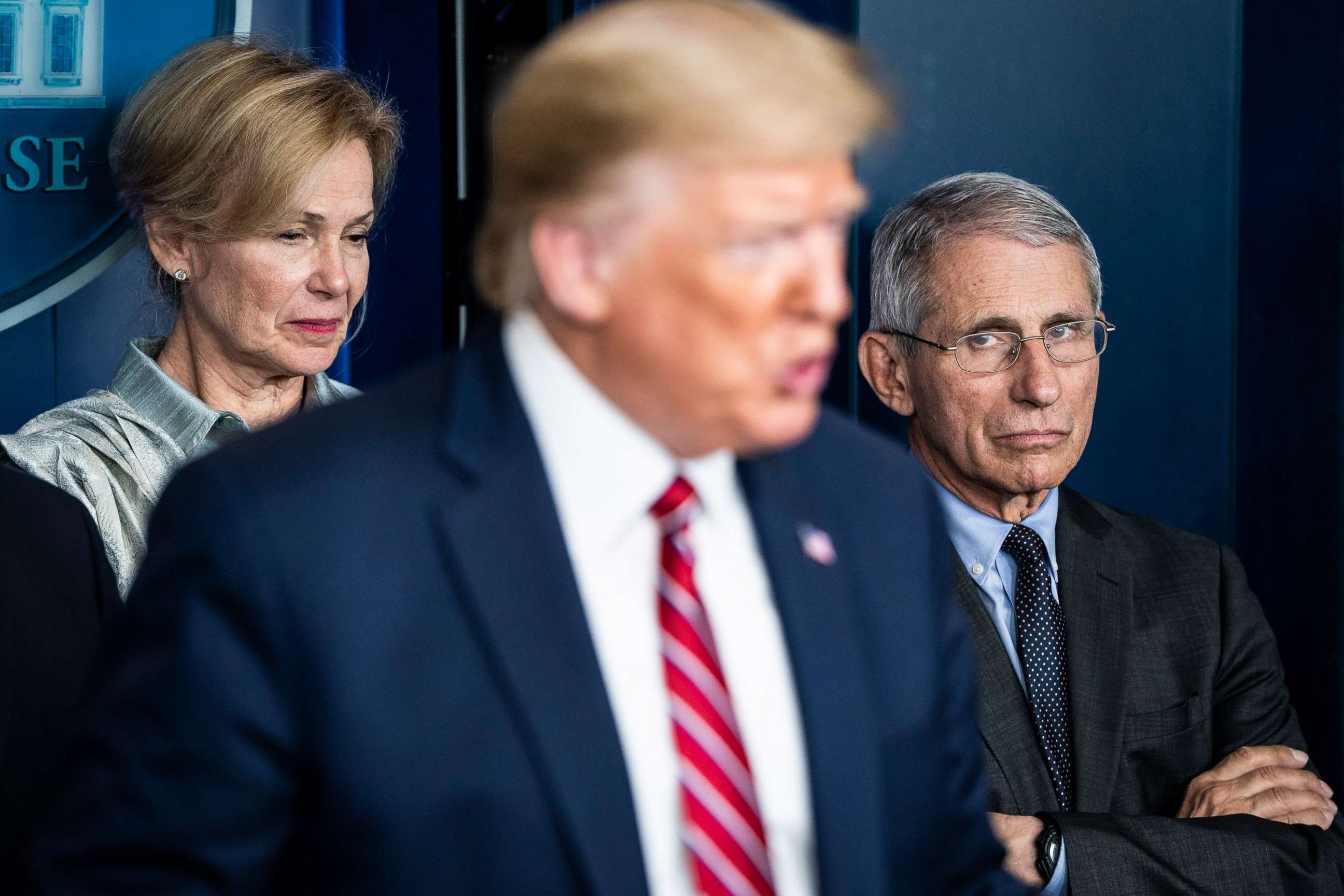 PHOTO: Dr. Anthony Fauci, right, listens as President Donald J. Trump speaks with the coronavirus task force during a news conference at the White House, March 20, 2020 in Washington.