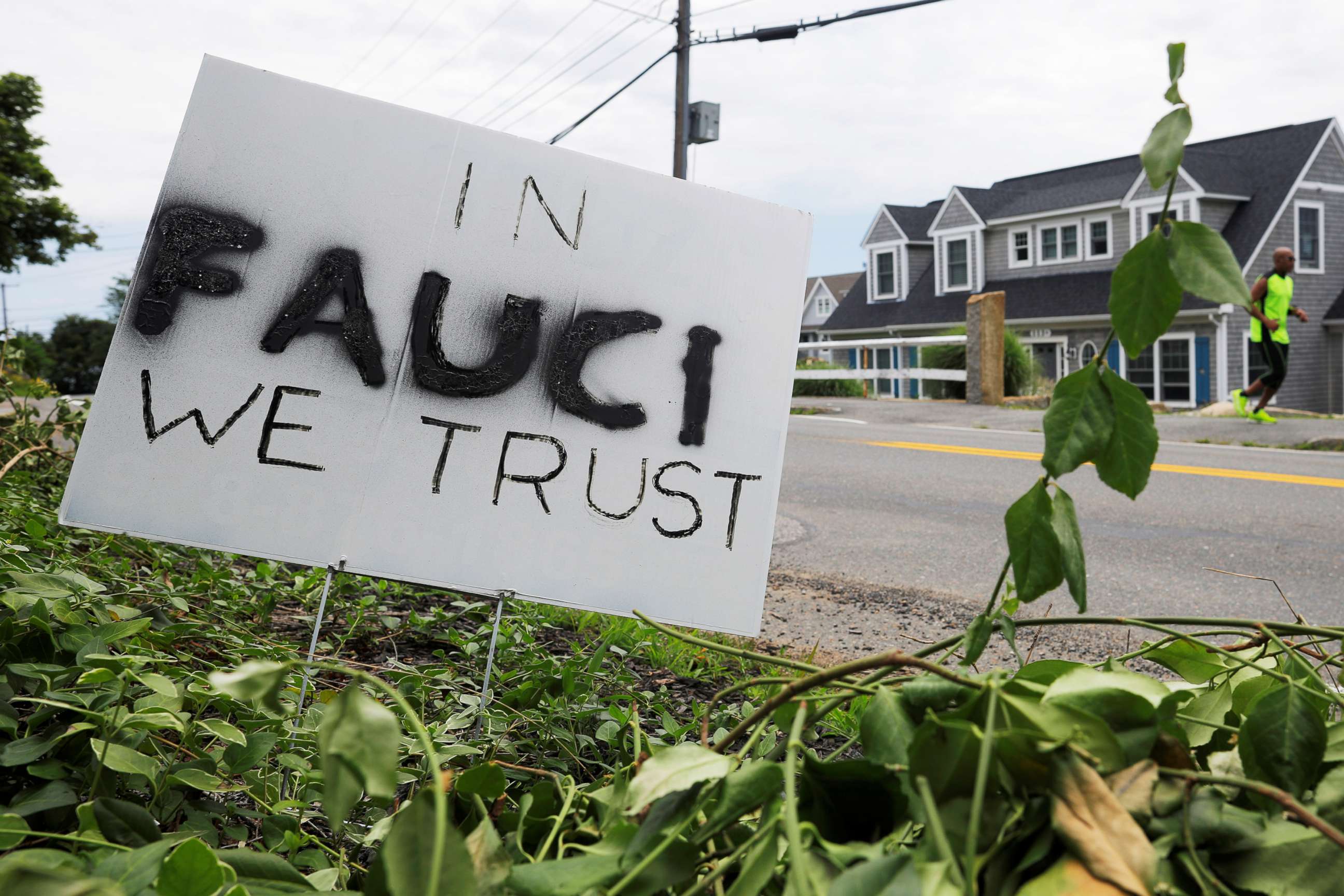 PHOTO: A sign reads "In Fauci We Trust," referring to the director of the National Institute of Allergy and Infectious Diseases Anthony Fauci, outside a home in Rockport, Mass.,  July 13, 2020.