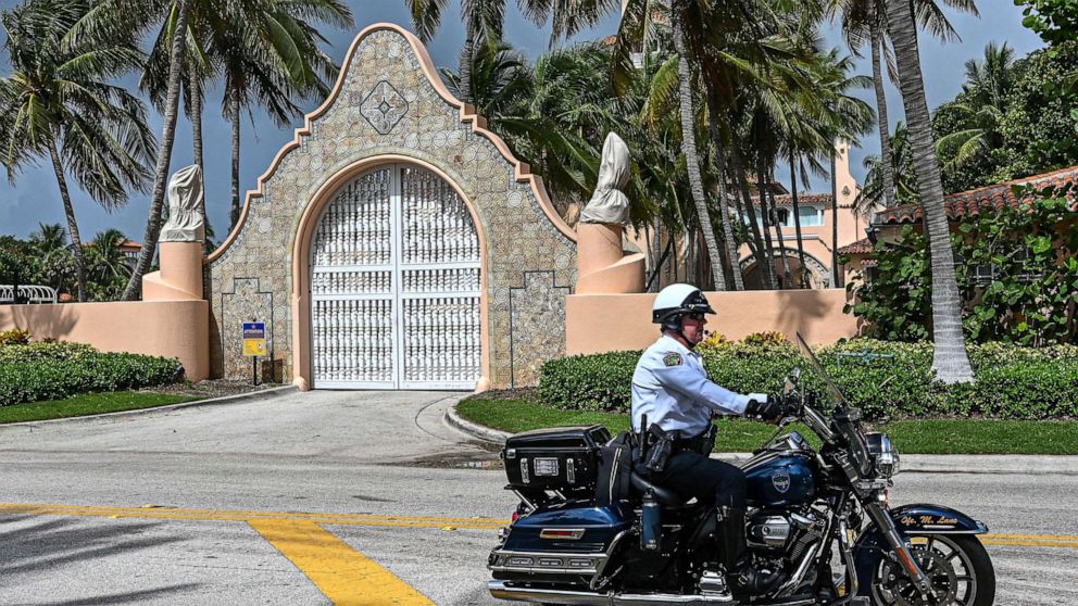 PHOTO: Local law enforcement officers patrol in front of the home of former President Donald Trump at Mar-A-Lago in Palm Beach, Fla., Aug. 9, 2022.