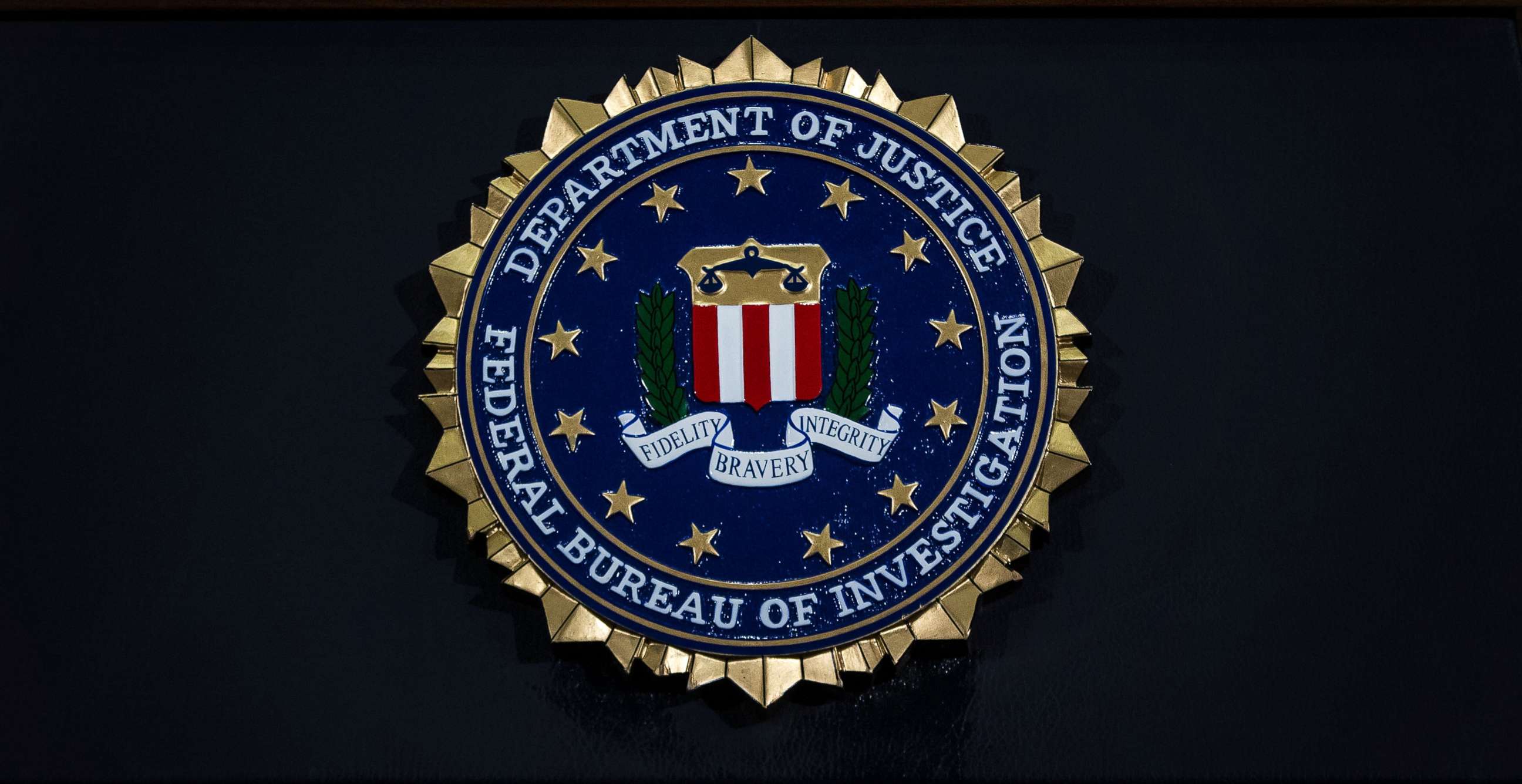 PHOTO: The seal of the Federal Bureau of Investigation hangs on a podium during a news conference at the FBI headquarters, June 14, 2018 in Washington.