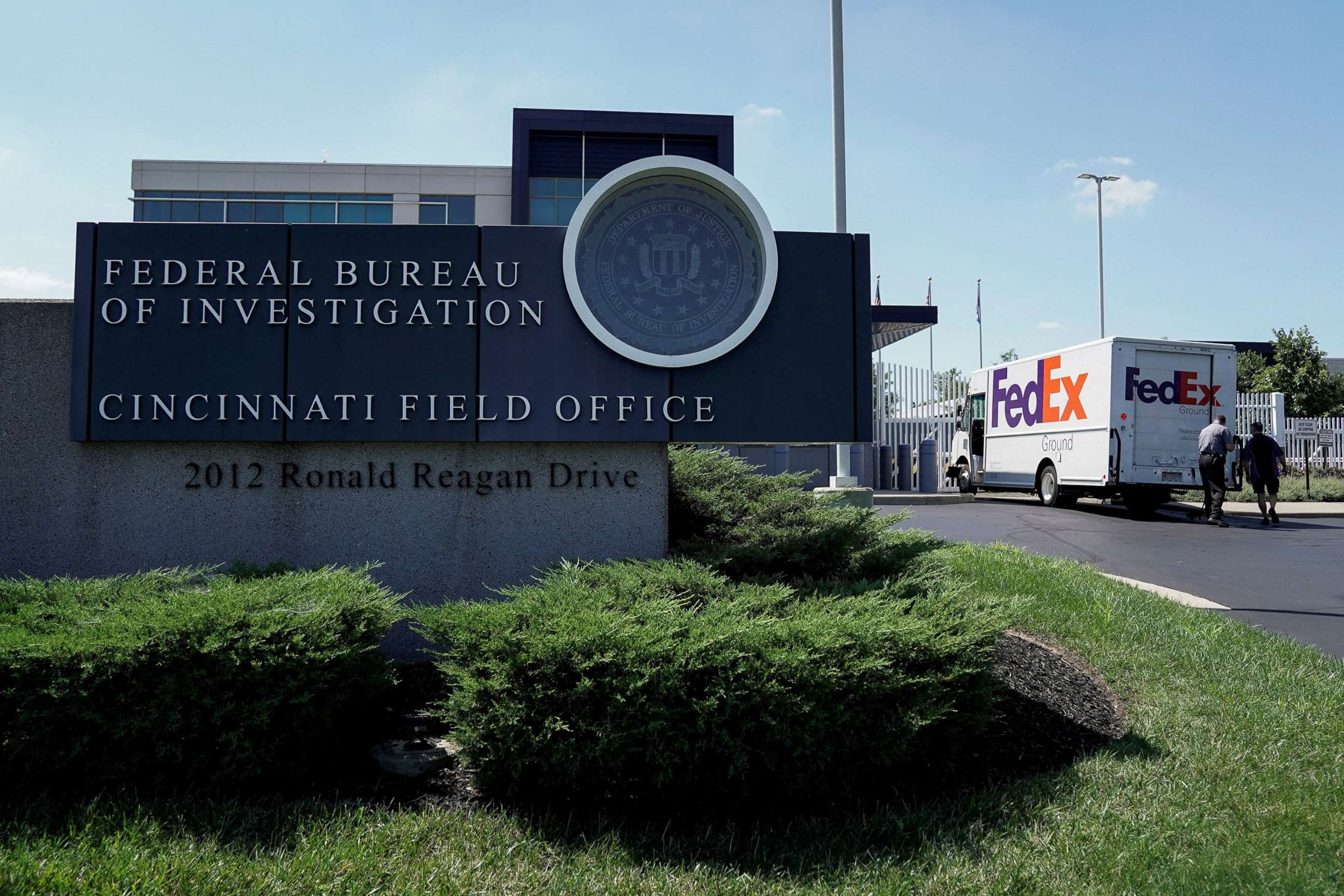 PHOTO: A FedEx truck is inspected outside of the front gate of the FBI's Field Office, after police closed off Interstate 71 North after reports of a suspect attempting to attack the FBI building, in Cincinnati, Aug. 11, 2022. 
